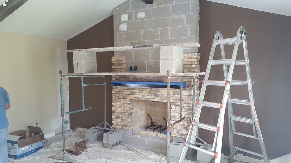 Construction on indoor fireplace.