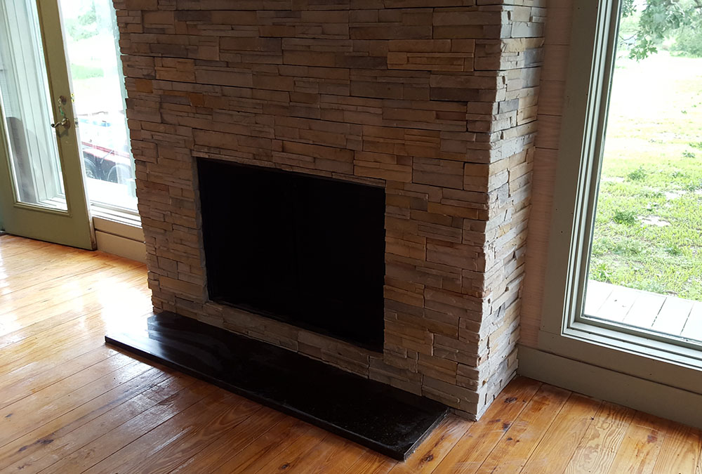 Indoor fireplace with stone. 