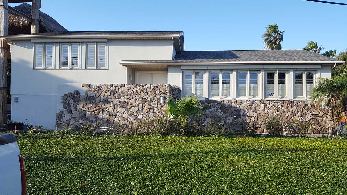 Stone walls on home are shown. 