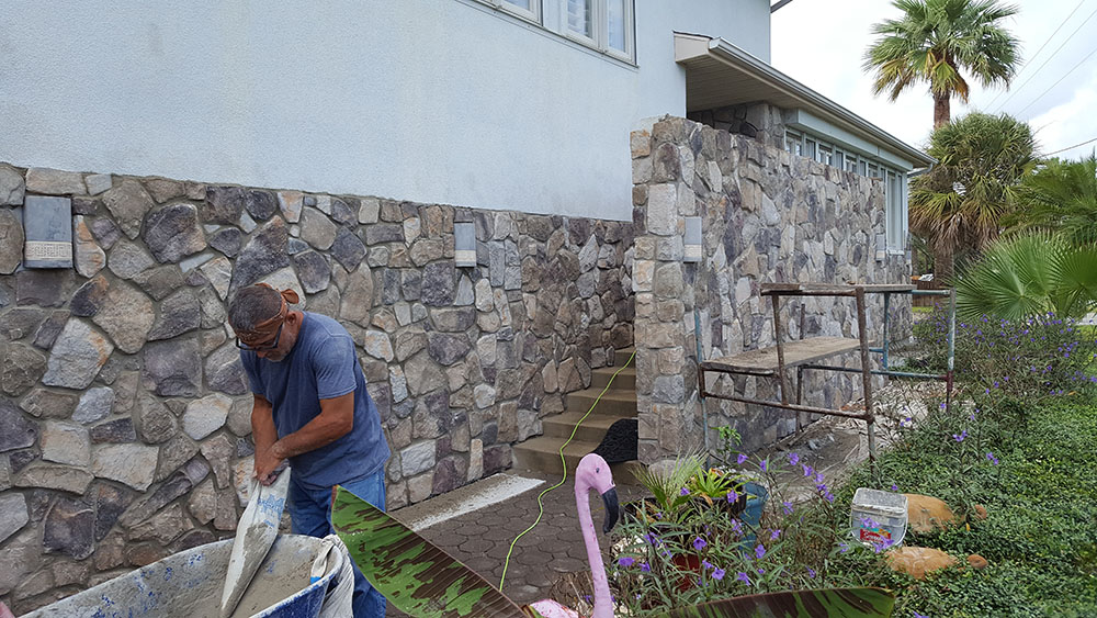 Building stone walls on exterior of home. 