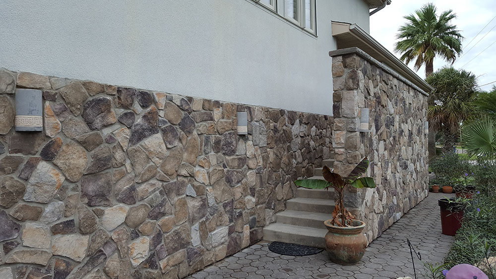 Beautiful stone walls on entrance of home. 