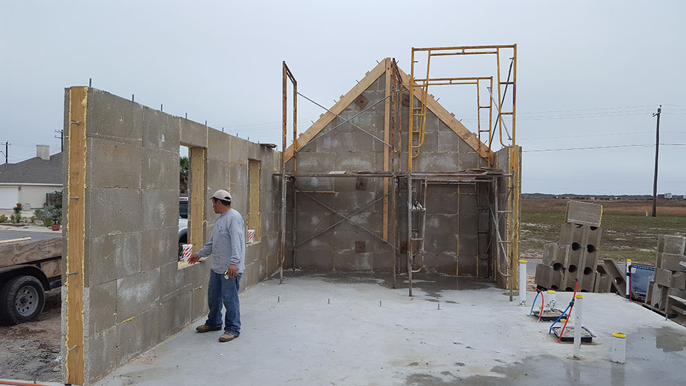 A photo of one of our masonry contractors is shown. 