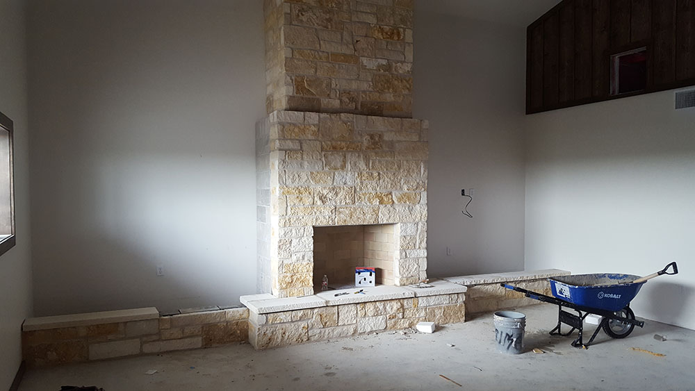 Stone indoor fireplace. 