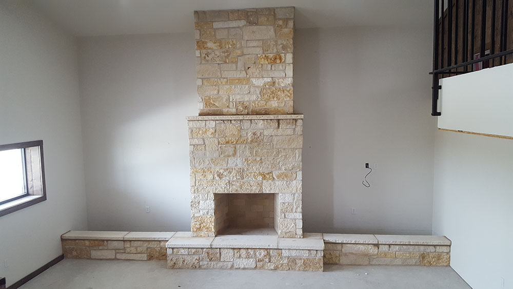 Stonework on indoor fireplace. 