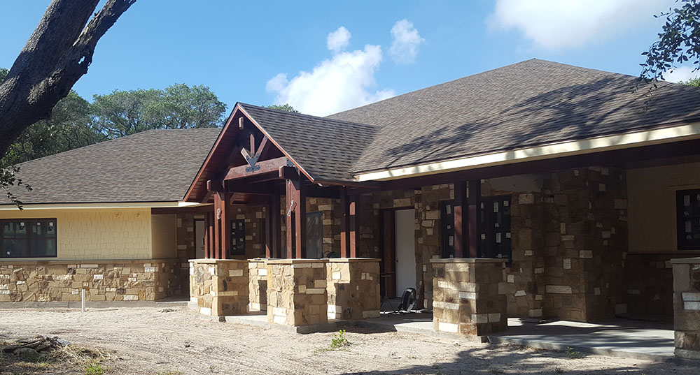 Ledgestone pillars are shown. 