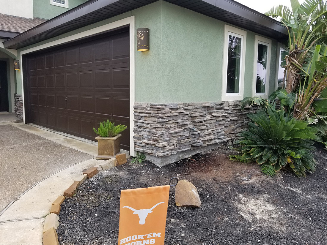 Stone walls accenting home. 