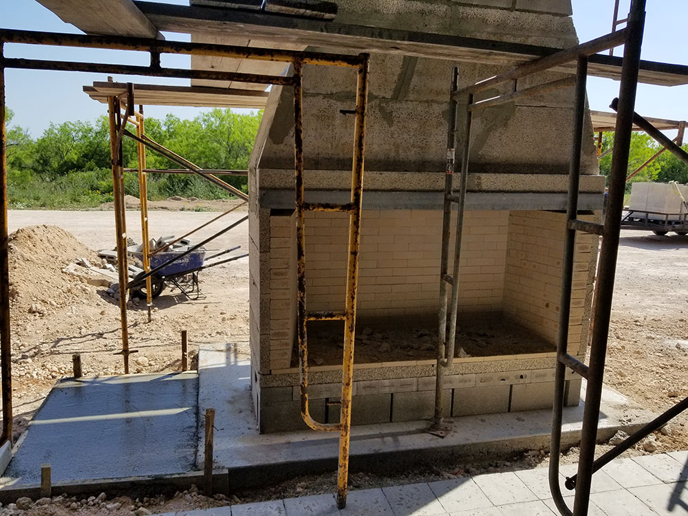 Construction an outdoor fireplace.