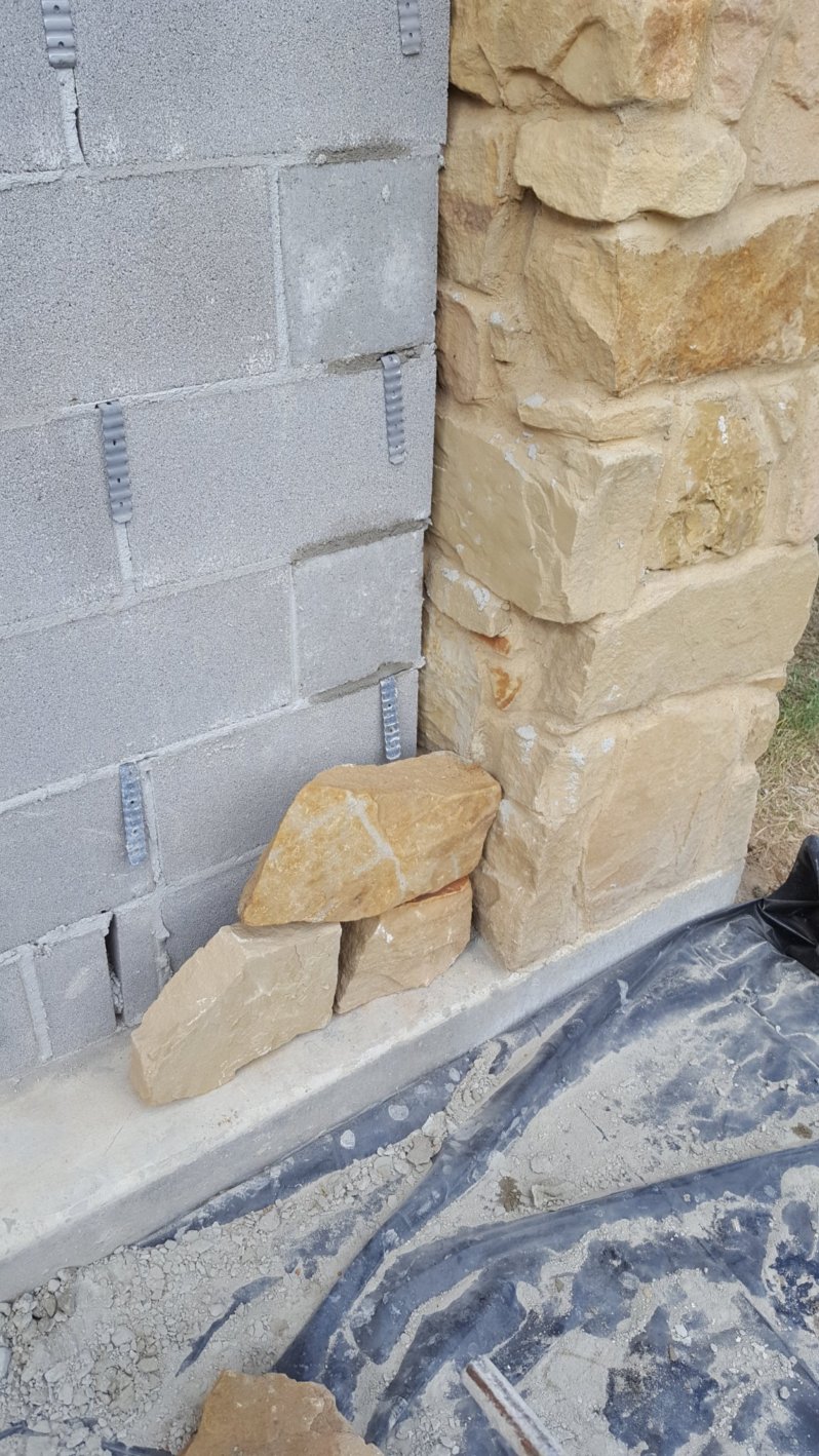 Stonework on an outdoor fireplace is shown. 